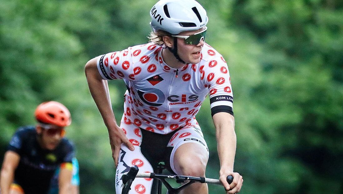 An elite cyclist participating in the Prospect Park L&C Race Series, launching a powerful attack on the field. Achieving peak results through top coaching, advanced technology, and high-performance training.Picture