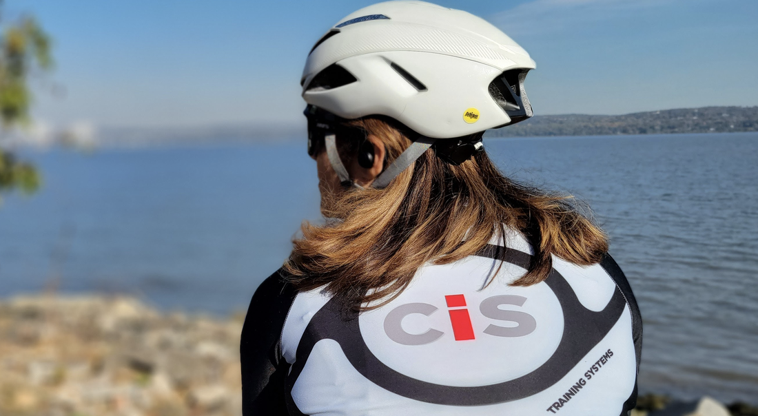 Two CIS Training Systems athletes standing back to back showing the Black Cycling Kit and Red Cycling Kit wth CIS Logo on the back.